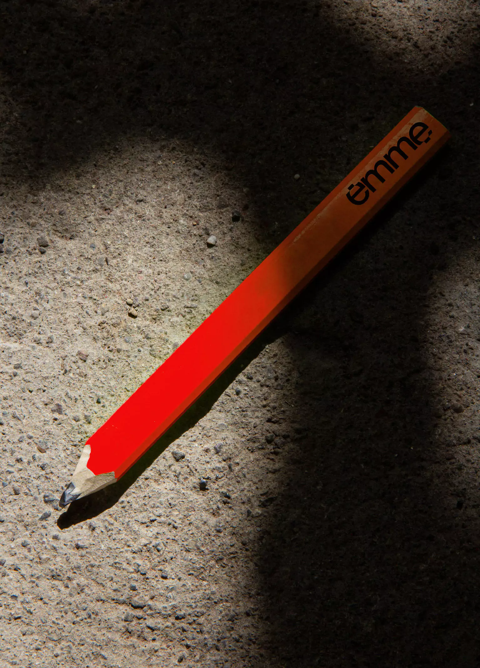 Visual Identity for Emme - Logotype in a Red Pencil